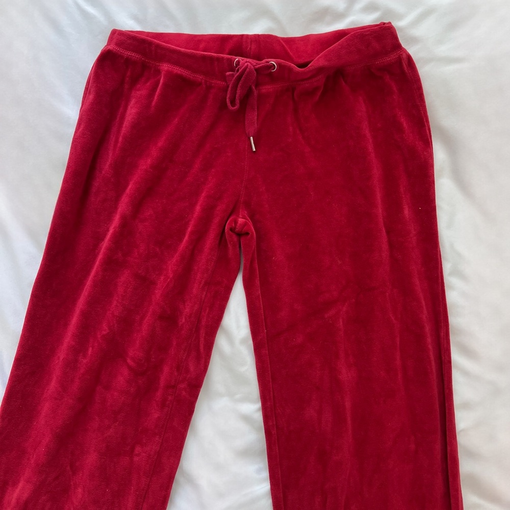 Red velour track pants